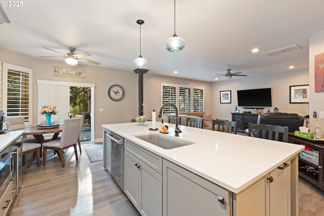 24150 NW Green Mountain Rd, Banks, OR 97106 - kitchen featuring a ceiling fan, a sink, dishwasher, open floor plan, and light countertops