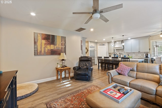 24150 NW Green Mountain Rd, Banks, OR 97106 - living room with a ceiling fan, light wood-style flooring, baseboards, and recessed lighting