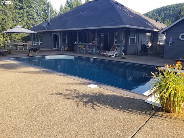 24150 NW Green Mountain Rd, Banks, OR 97106 - swimming pool with a patio area