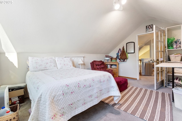 24150 NW Green Mountain Rd, Banks, OR 97106 - bedroom with carpet floors, vaulted ceiling, and baseboards