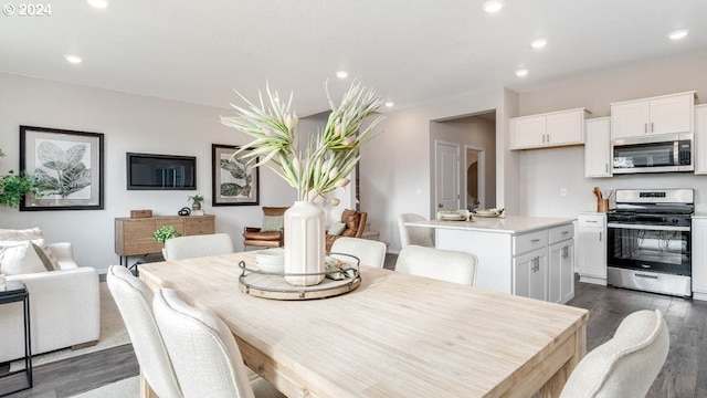 dining area featuring recessed lighting and dark wood finished floors