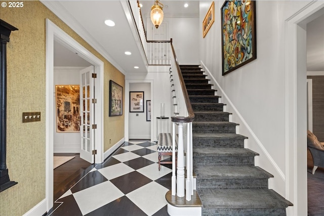 entryway with baseboards, recessed lighting, tile patterned floors, and crown molding