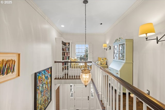 hallway featuring ornamental molding