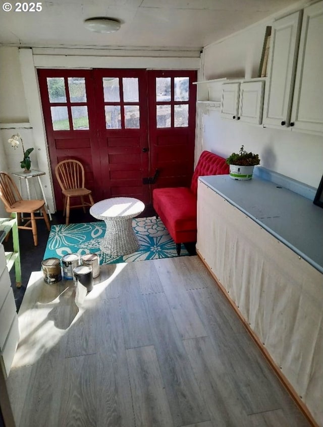 1078 Harrison Ave, Astoria, OR 97103 - sitting room with healthy amount of natural light and wood finished floors