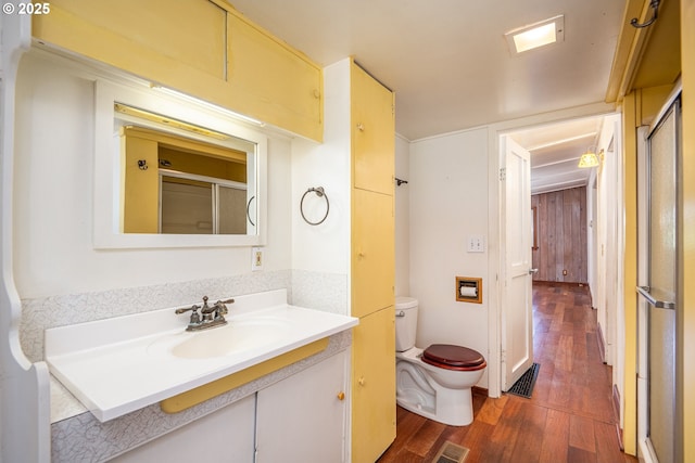 32468 Dillard Rd, Eugene, OR 97405 - bathroom with wood finished floors, vanity, and a shower with door