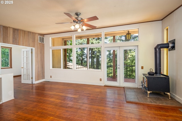 32468 Dillard Rd, Eugene, OR 97405 - unfurnished living room featuring french doors, a wood stove, wood-type flooring, and a ceiling fan