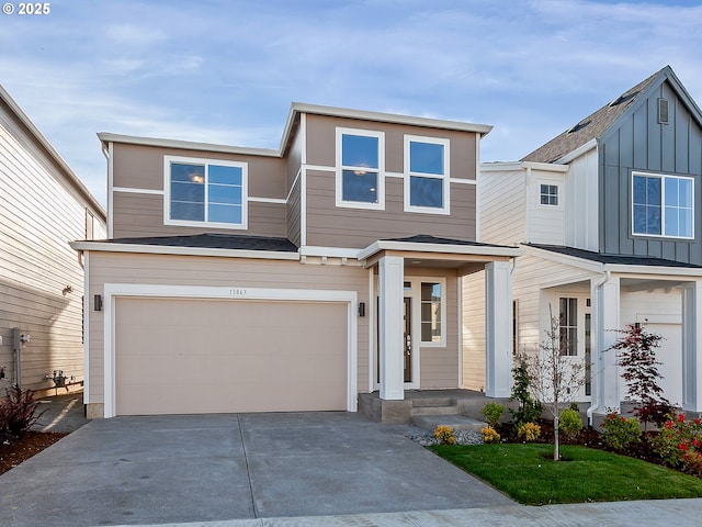 13863 SW Sabrina Ave, Tigard, OR 97140 - view of front of house with an attached garage, concrete driveway, and board and batten siding