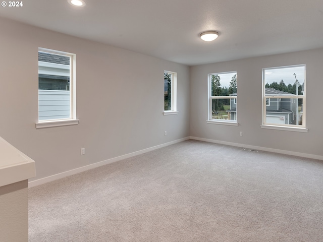 empty room featuring carpet floors