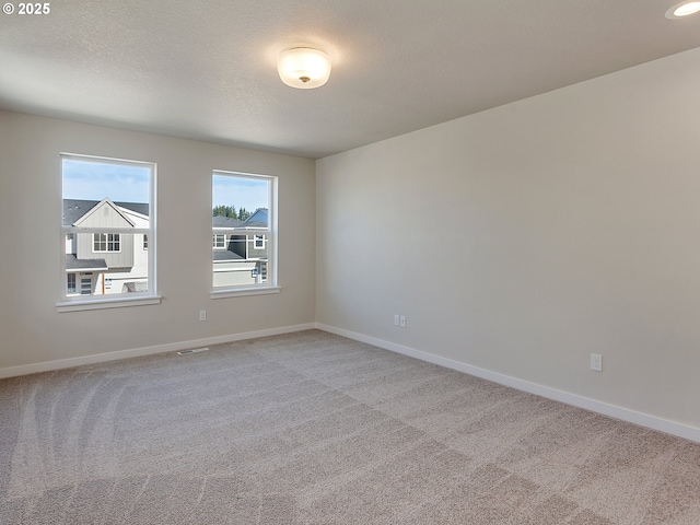 13863 SW Sabrina Ave, Tigard, OR 97140 - unfurnished room featuring light carpet and baseboards
