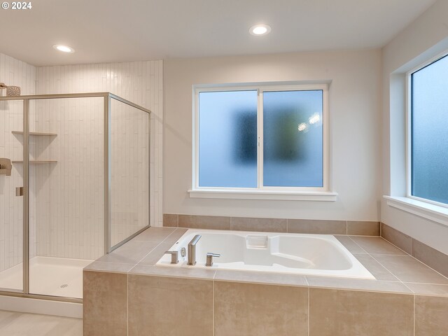 bathroom with vanity, tile patterned floors, and shower with separate bathtub