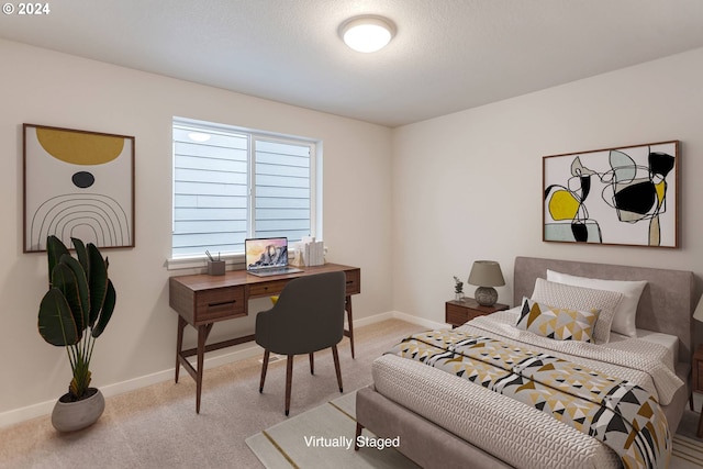 carpeted bedroom featuring a textured ceiling