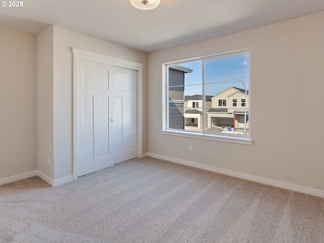 13863 SW Sabrina Ave, Tigard, OR 97140 - unfurnished bedroom with carpet flooring, baseboards, and a closet