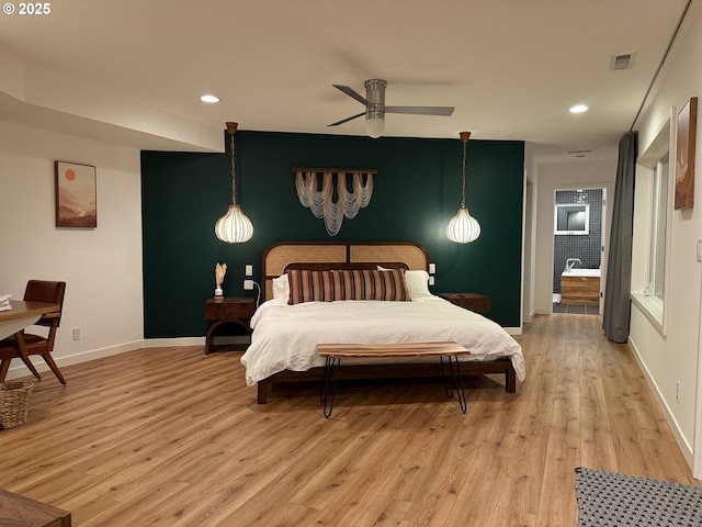 bedroom with recessed lighting, light wood-type flooring, visible vents, and baseboards