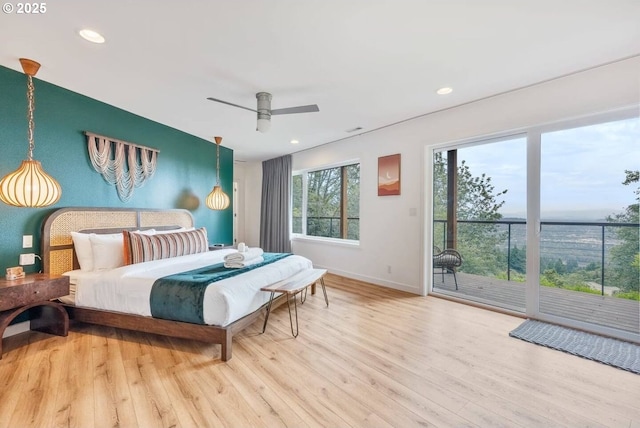 bedroom with access to exterior, recessed lighting, baseboards, and wood finished floors