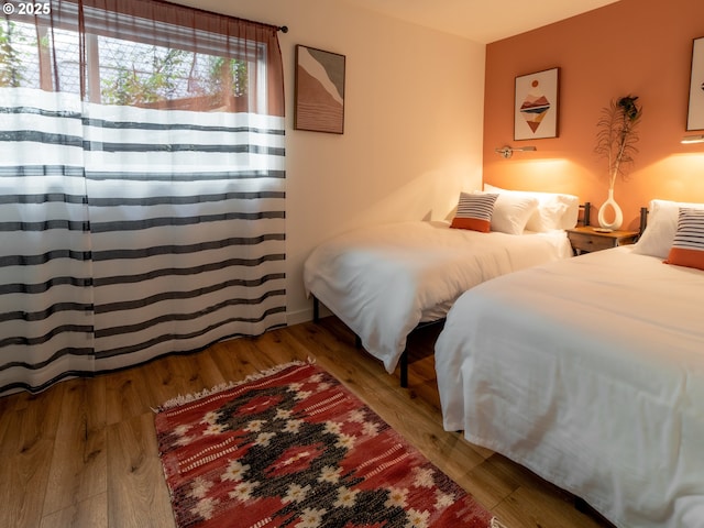 bedroom featuring wood finished floors