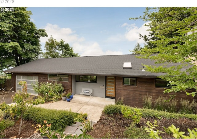 4444 SW Council Crest Dr, Portland, OR 97239 - view of front of property with roof with shingles and a garage