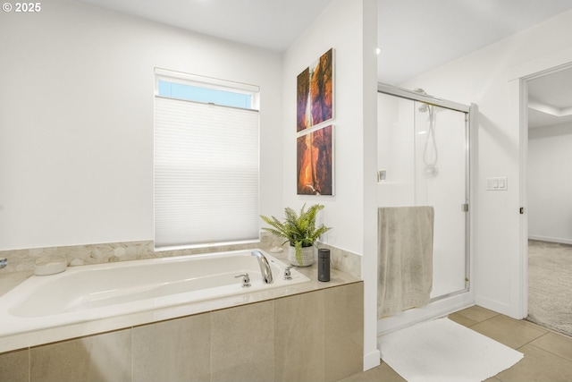 bathroom featuring independent shower and bath and tile patterned floors