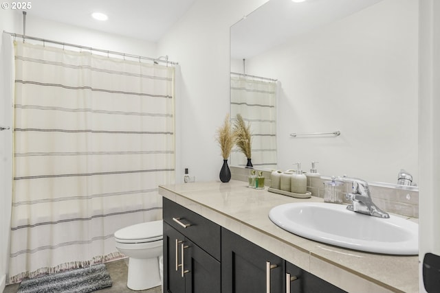 bathroom with toilet and vanity