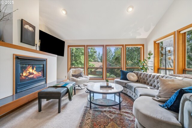 13305 Fox Run, Lake Oswego, OR 97034 - living room with lofted ceiling, healthy amount of natural light, a glass covered fireplace, carpet, and recessed lighting