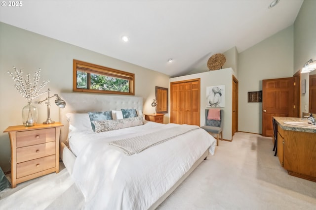 13305 Fox Run, Lake Oswego, OR 97034 - bedroom featuring a closet, vaulted ceiling, and light colored carpet