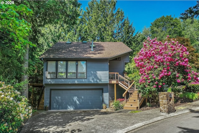 13305 Fox Run, Lake Oswego, OR 97034 - view of front of house with stairs, a garage, driveway, and roof with shingles