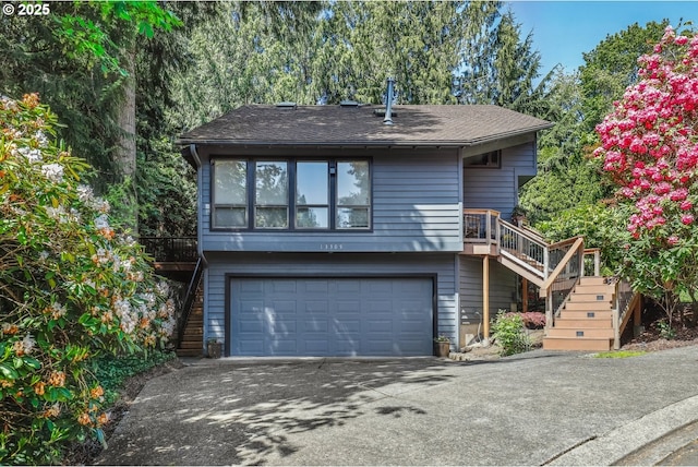13305 Fox Run, Lake Oswego, OR 97034 - view of front of home with stairway, a garage, driveway, and roof with shingles