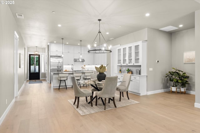 15007 Twin Fir Rd, Lake Oswego, OR 97035 - dining room featuring light wood-style flooring, recessed lighting, and a chandelier