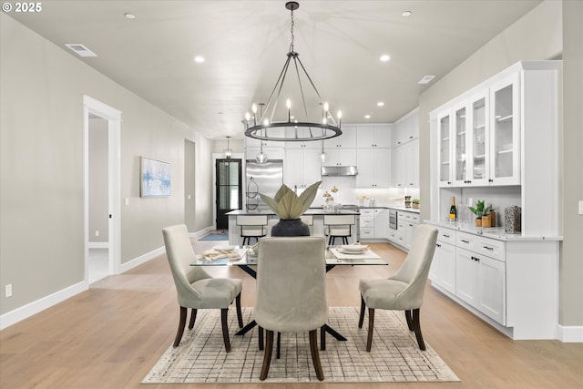 15007 Twin Fir Rd, Lake Oswego, OR 97035 - dining room with a chandelier, light wood-style flooring, and recessed lighting