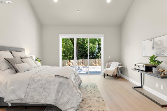 15007 Twin Fir Rd, Lake Oswego, OR 97035 - bedroom with access to exterior, wood finished floors, vaulted ceiling, and recessed lighting