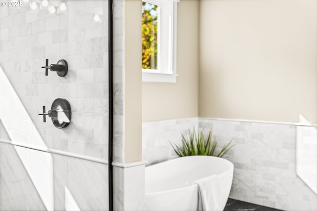 15007 Twin Fir Rd, Lake Oswego, OR 97035 - bathroom featuring a freestanding bath, a tile shower, and a wainscoted wall