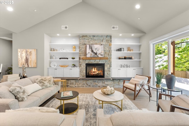 15007 Twin Fir Rd, Lake Oswego, OR 97035 - living area featuring light wood-style floors, high vaulted ceiling, a fireplace, recessed lighting, and built in shelves