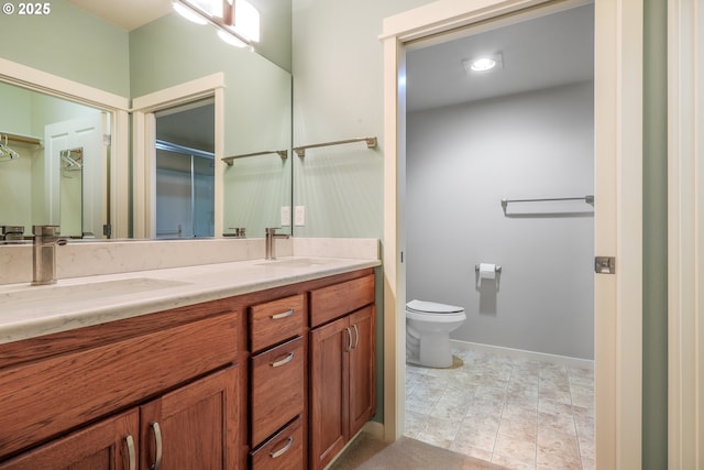 bathroom with toilet and vanity