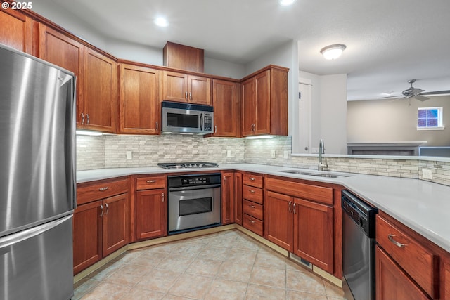 kitchen with light tile patterned floors, sink, stainless steel appliances, and backsplash