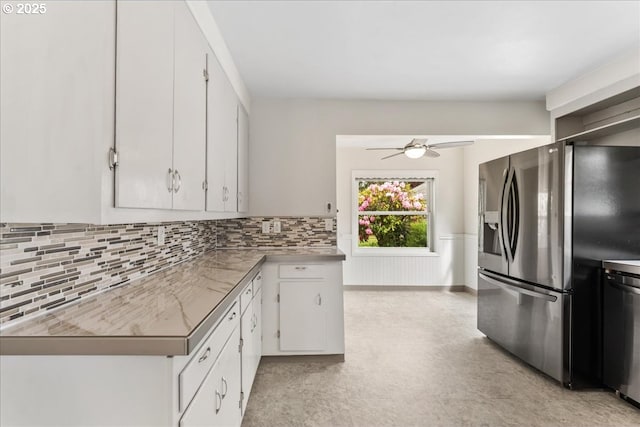4004 SE 97th, Portland, OR 97266 - kitchen with appliances with stainless steel finishes, a ceiling fan, white cabinetry, decorative backsplash, and wainscoting