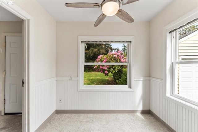4004 SE 97th, Portland, OR 97266 - spare room featuring a wainscoted wall, plenty of natural light, a ceiling fan, and baseboards