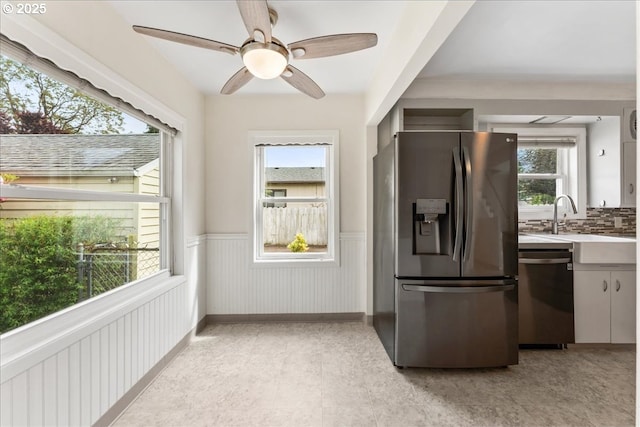 4004 SE 97th, Portland, OR 97266 - kitchen with appliances with stainless steel finishes, wainscoting, ceiling fan, light countertops, and a sink