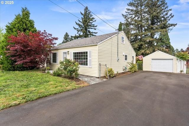 4004 SE 97th, Portland, OR 97266 - view of home's exterior with a garage, an outbuilding, driveway, and a lawn