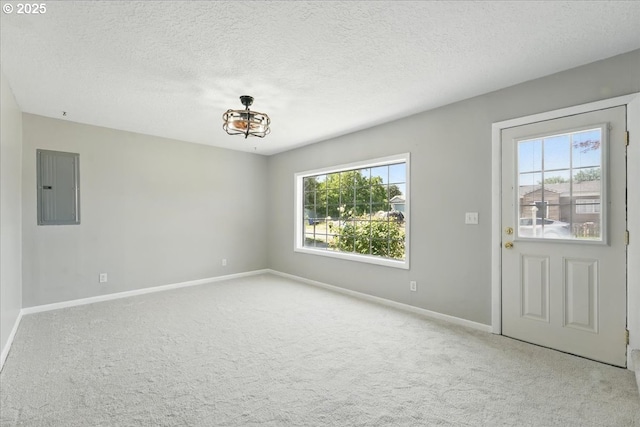 4004 SE 97th, Portland, OR 97266 - foyer featuring electric panel, healthy amount of natural light, baseboards, carpet flooring, and a textured ceiling