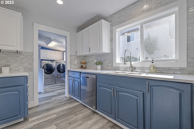 1060 SW 206th Ave, Beaverton, OR 97003 - kitchen featuring blue cabinets, tasteful backsplash, dishwasher, a sink, and separate washer and dryer