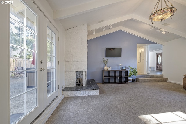 1060 SW 206th Ave, Beaverton, OR 97003 - carpeted living room featuring rail lighting and lofted ceiling