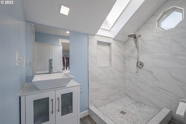 1060 SW 206th Ave, Beaverton, OR 97003 - bathroom with vanity, a tile shower, and a skylight