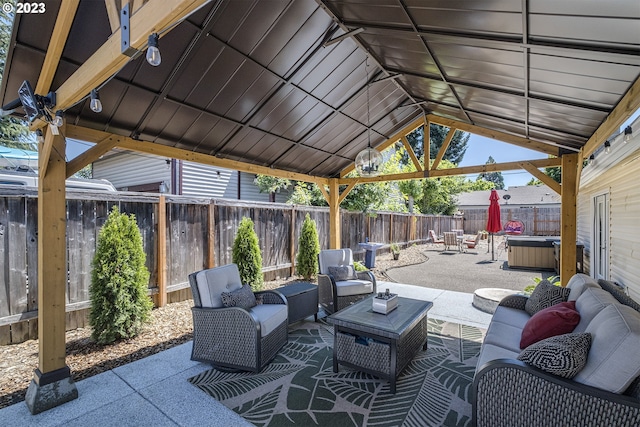 1060 SW 206th Ave, Beaverton, OR 97003 - view of patio featuring an outdoor hangout area, a gazebo, a hot tub, and a fenced backyard