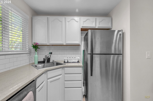 50 Cervantes Cir, Lake Oswego, OR 97035 - kitchen featuring freestanding refrigerator, dishwasher, tasteful backsplash, and white cabinetry