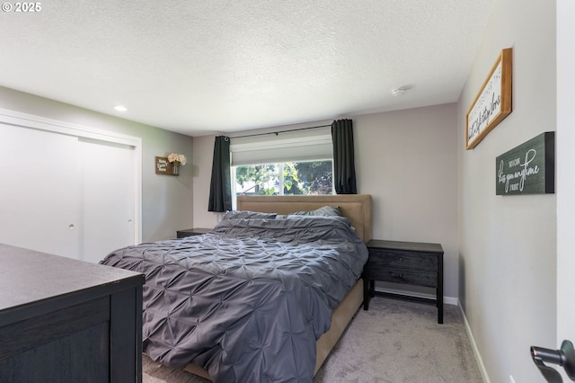 3141 SW 176th Ave, Beaverton, OR 97003 - bedroom with light colored carpet, a closet, a textured ceiling, and recessed lighting