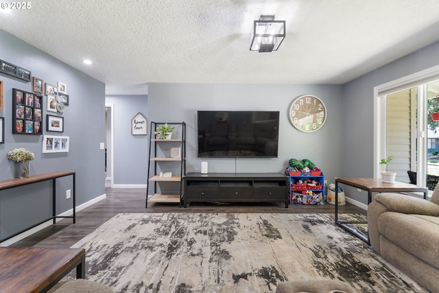 3141 SW 176th Ave, Beaverton, OR 97003 - living room featuring wood finished floors, a textured ceiling, and recessed lighting