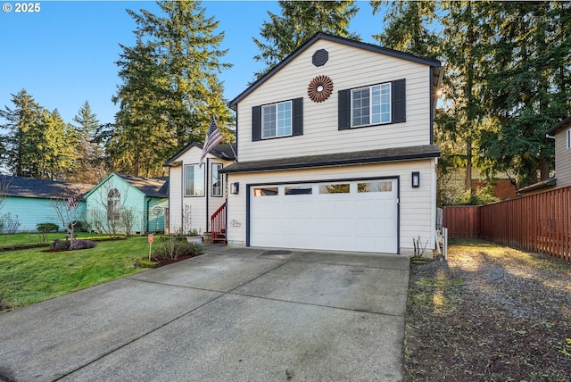 view of property featuring a garage and a front lawn