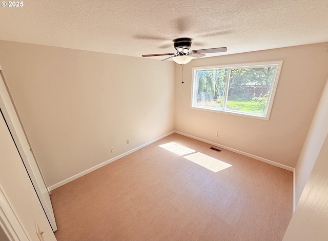 3880 SW 194th Pl, Beaverton, OR 97078 - spare room with a textured ceiling, carpet flooring, ceiling fan, and baseboards