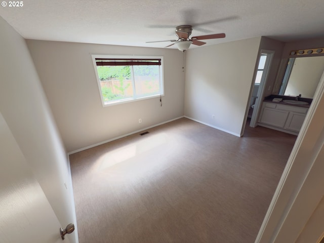 3880 SW 194th Pl, Beaverton, OR 97078 - unfurnished bedroom with a sink, baseboards, carpet floors, a textured ceiling, and ceiling fan