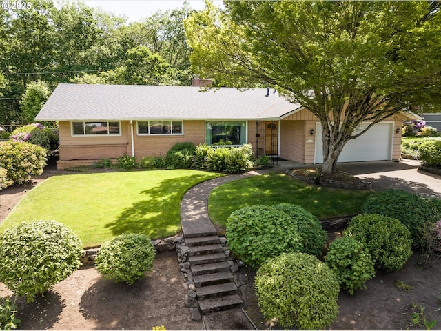3985 Donald St, Eugene, OR 97405 - ranch-style house with brick siding, driveway, a front yard, a garage, and a shingled roof