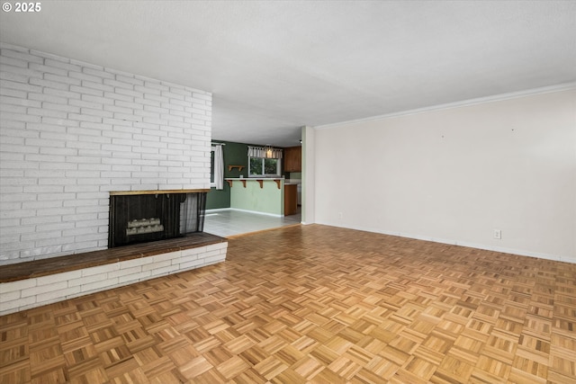 3985 Donald St, Eugene, OR 97405 - unfurnished living room with baseboards, a fireplace, and crown molding